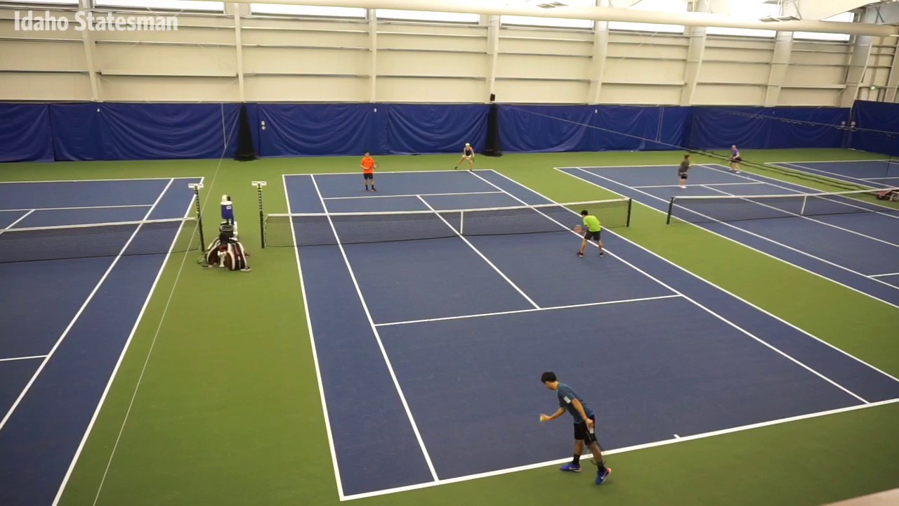 Interior of Eagle Tennis Club facility showing indoor courts